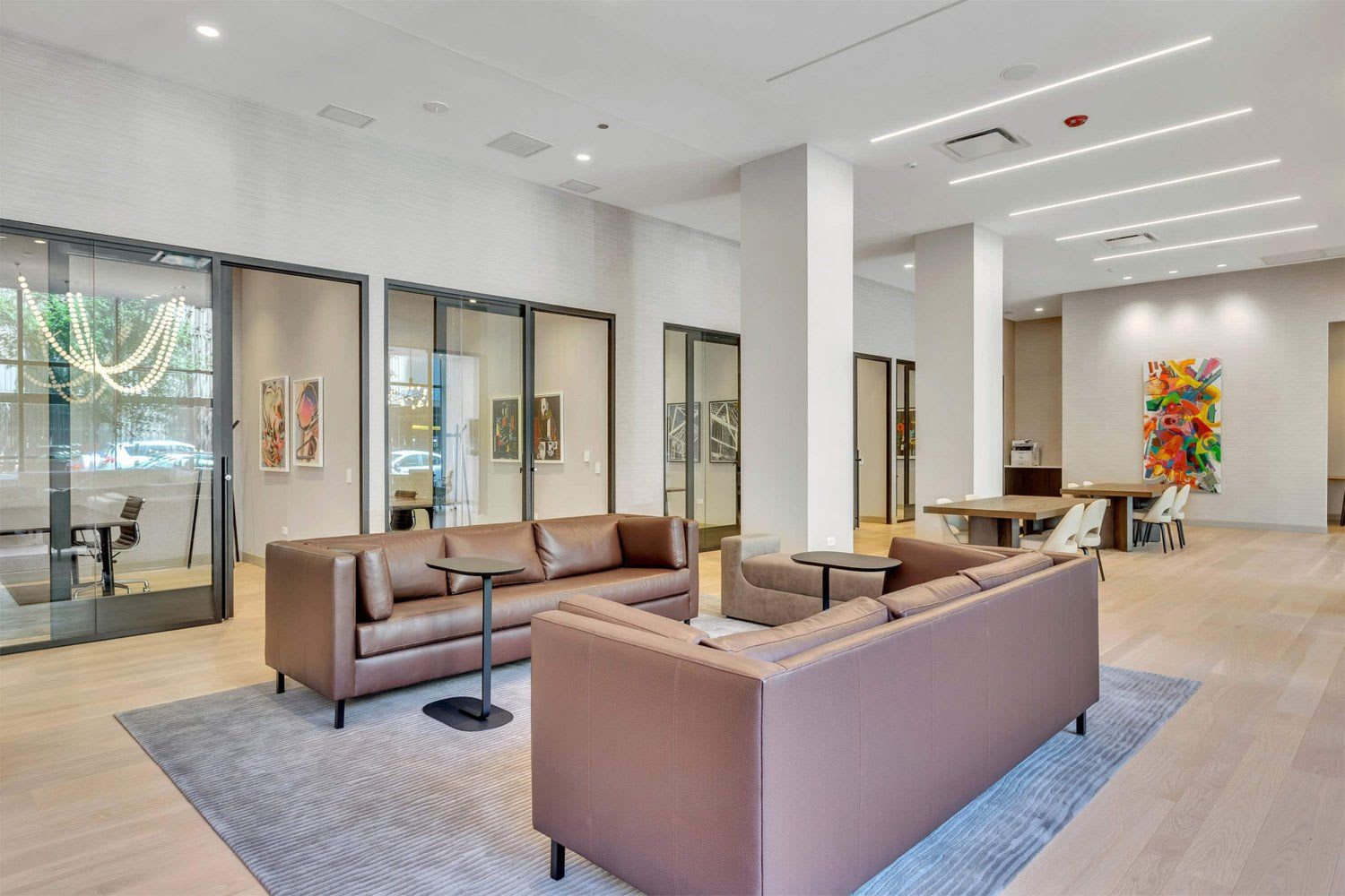 Residential co-working space with several couches and offices.