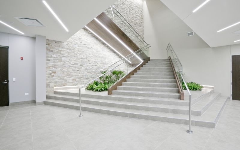 The staircase leading to the 2nd floor, decorated by lighting.