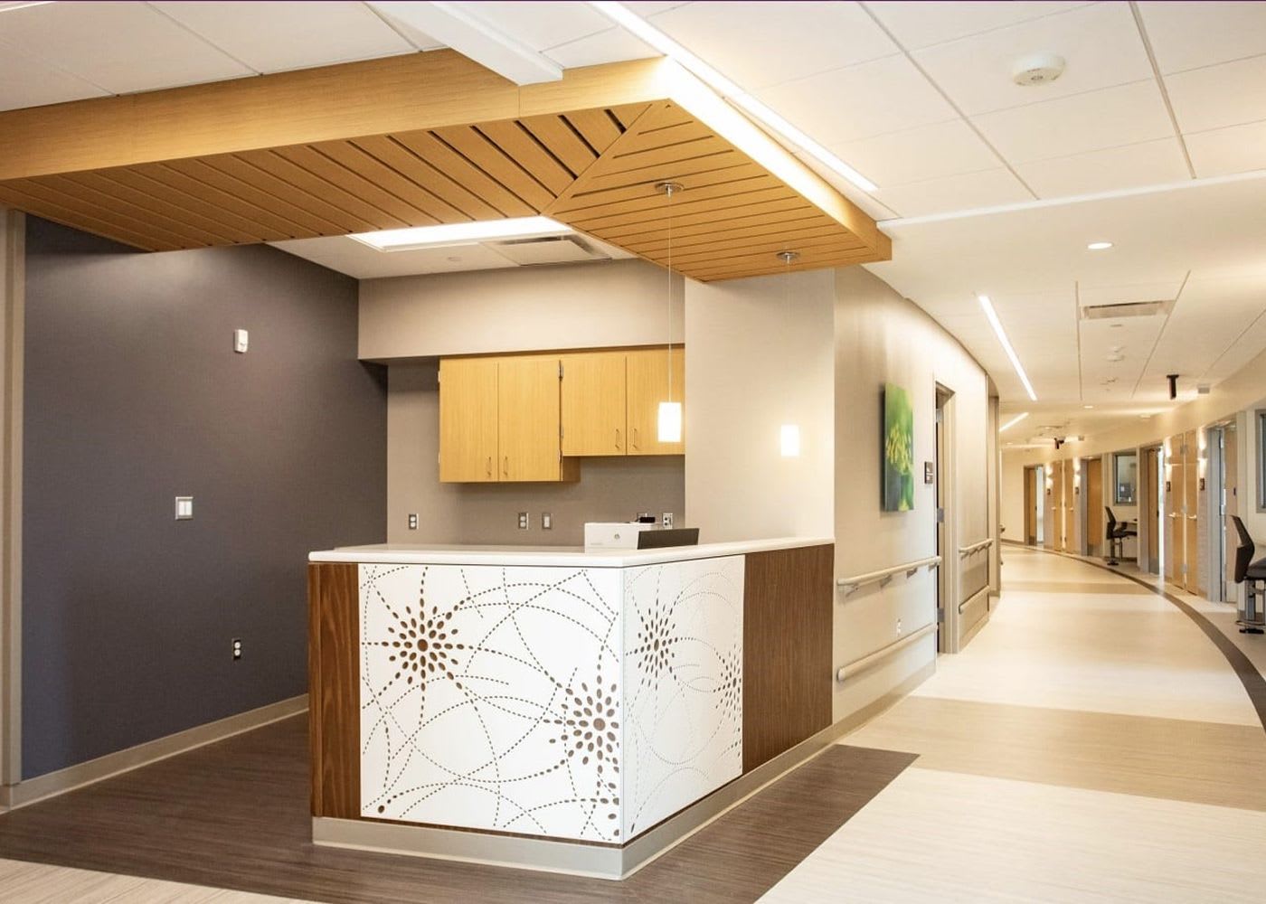 Hallway view showing various patient rooms.