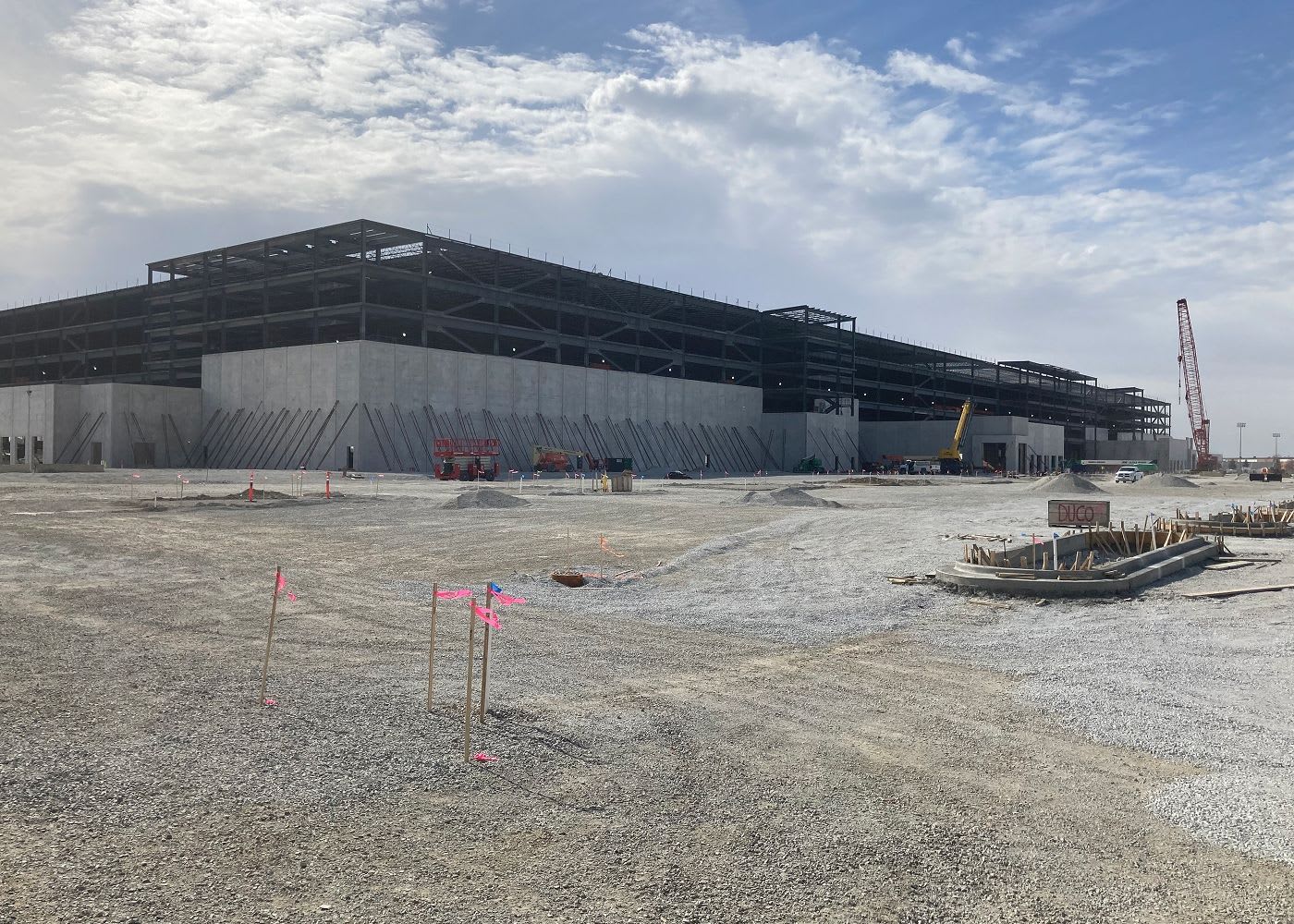 Another angle of Amazon's large construction center with a crane in the distance.