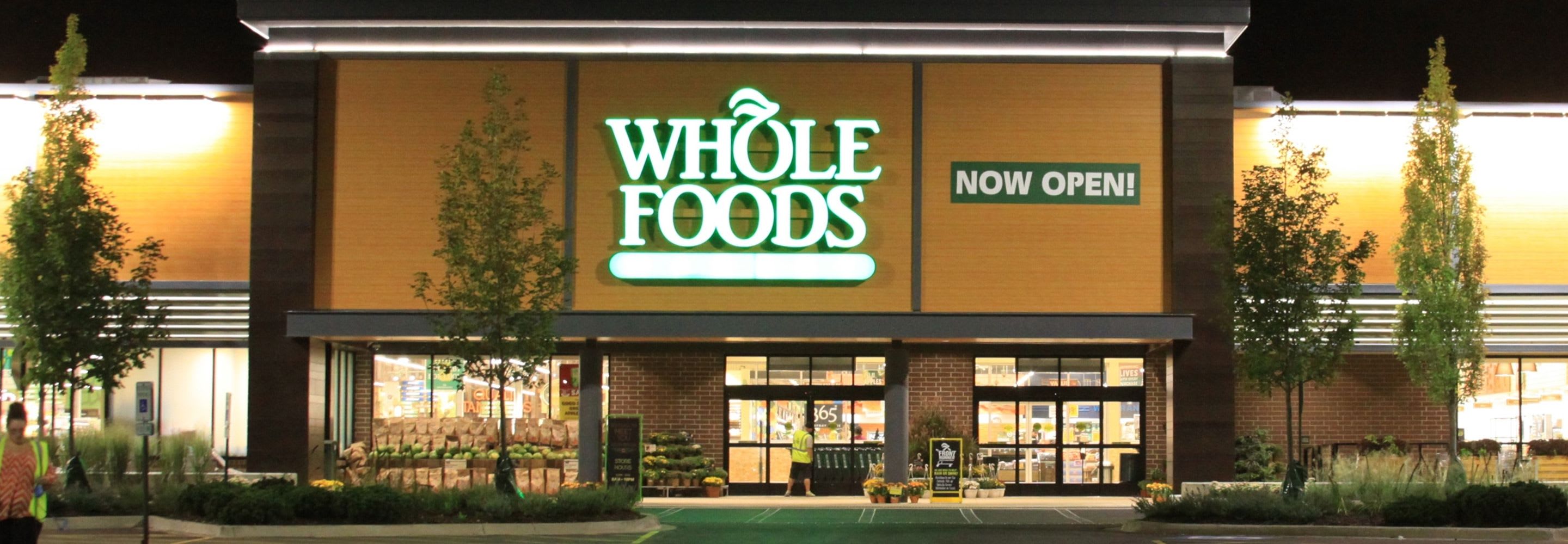 The outside view of the Whole Foods in Willowbrook at night.