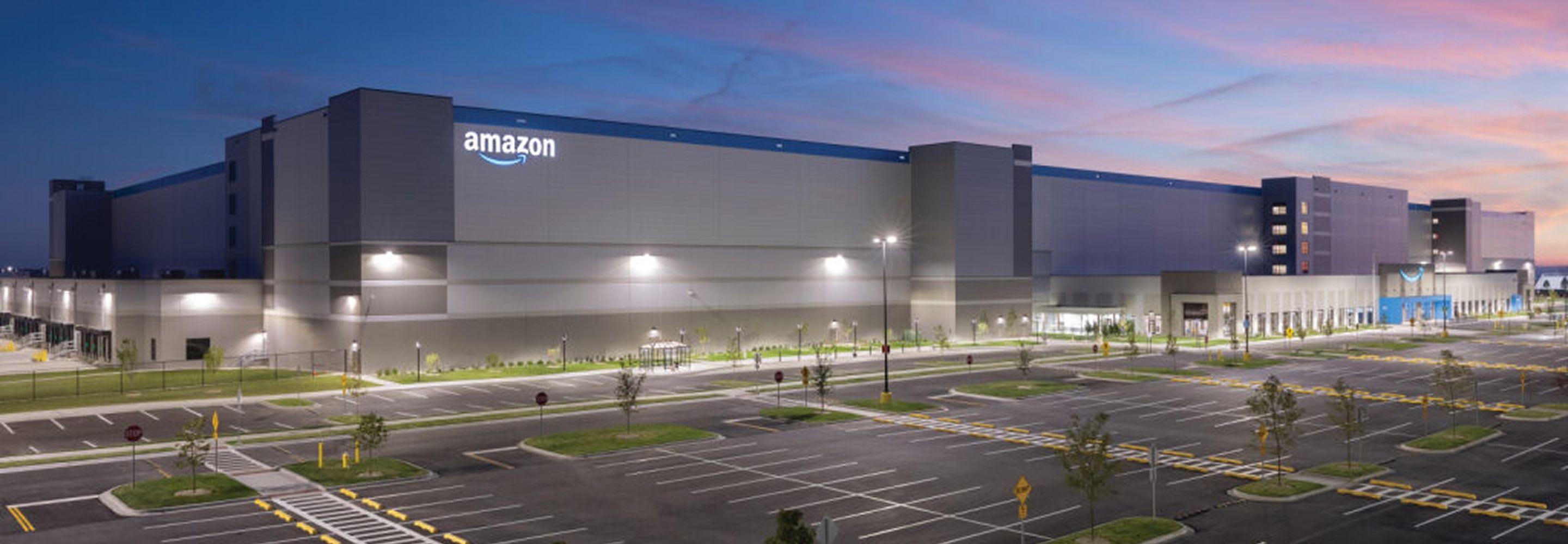 The outside of Amazon's center during the night.