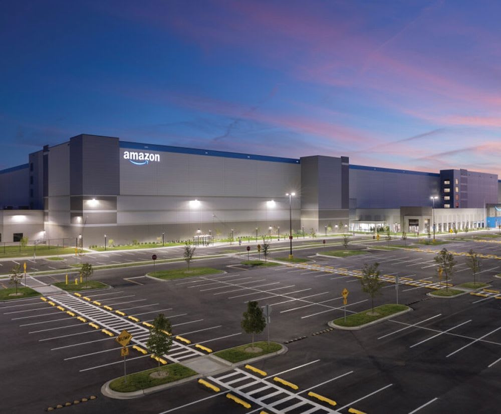 The outside of Amazon's center during the night.