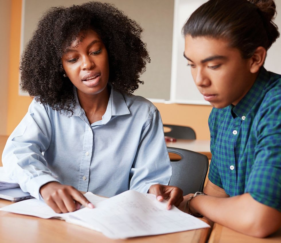 tutor going over worksheet in an individual tutoring session