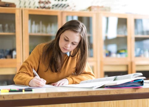 student completing an assignment in a science lab
