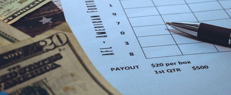 Super Bowl squares betting chart next to money | Are Super Bowl Pools Legal and Safe? | DOT Security