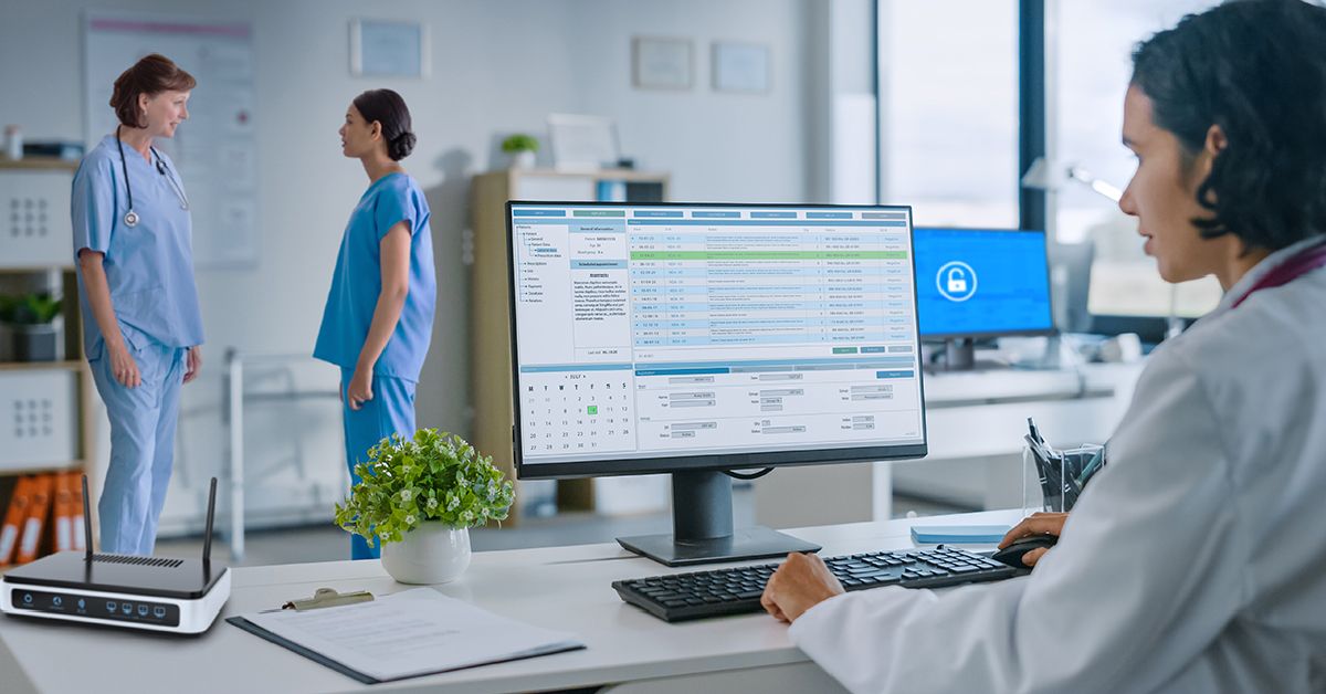 woman working at desk in doctor's office HIPAA