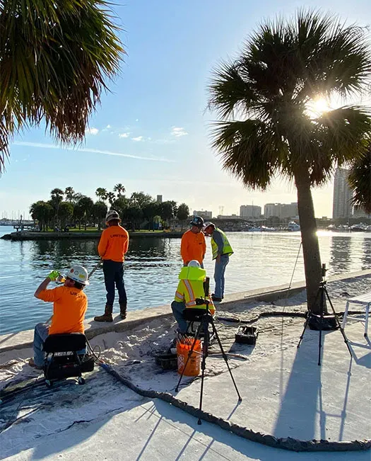 Four URETEK technicians assessing pier