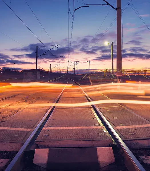 Railroad crossing at sunset