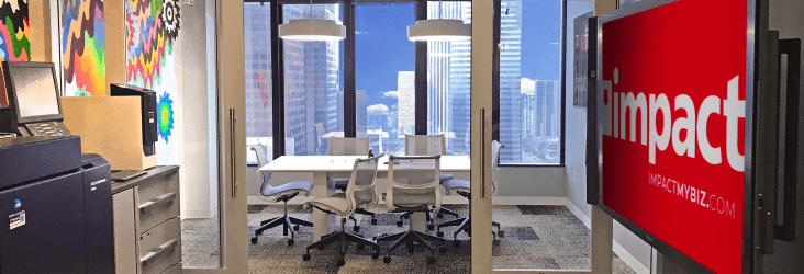 Interior of Impact Networking office building in downtown Los Angeles | Office common area and conference room with a view of downtown LA