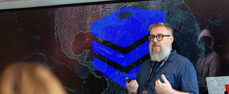 Jon Evans presenting at DOT Security's cybersecurity summit 