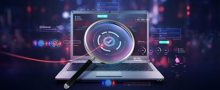 A magnifying glass in front of a laptop screen with metrics and analytics to the side