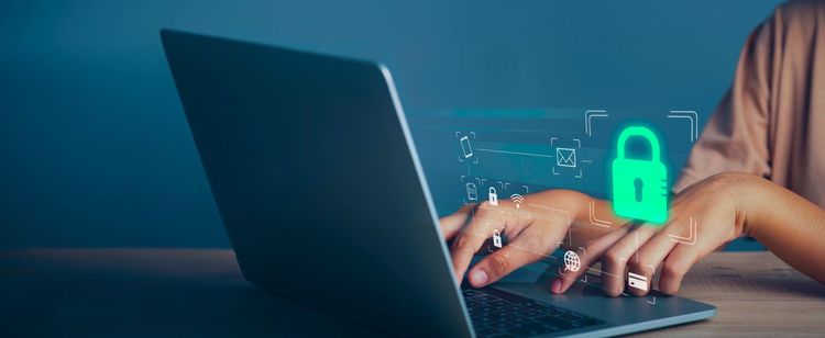 A users hands working a laptop with a digital lock separated from the screen