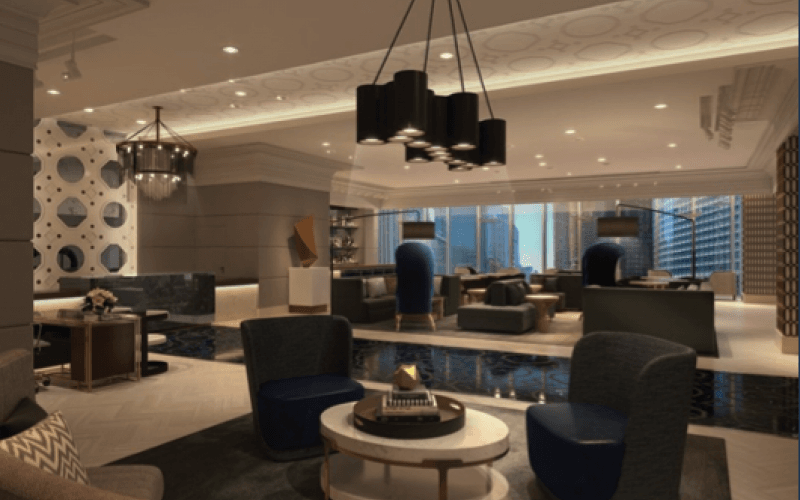 The lounge inside London House, illuminated by ceiling lights and pendant hanging lights.