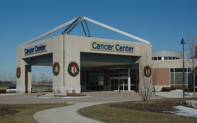 The entrance of Edward-Elmhurst Hospital with the words 'Cancer Center' on the building.