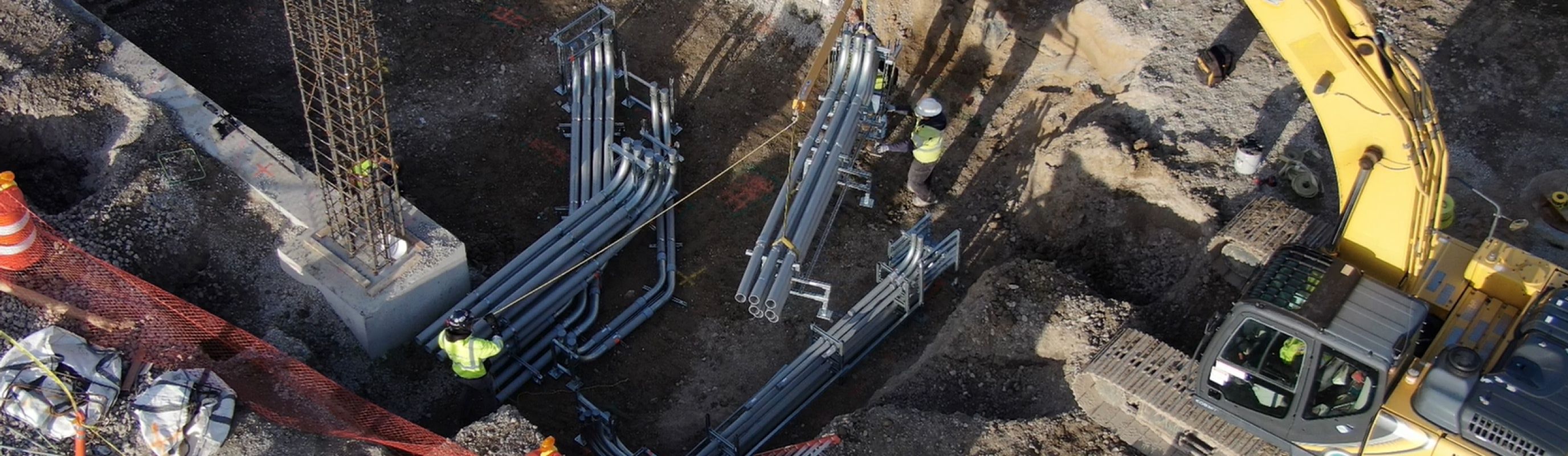 Electrical Construction site placing prefabricated duct banks underground
