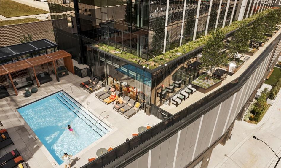 Outdoor amenities, pool, cabanas, and seating at the Coppia Apartment Complex in Chicago, IL.