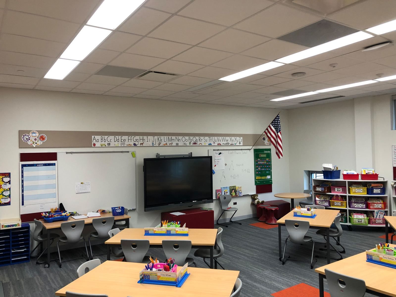 An East Prairie classroom, showing some desks facing a teacher's desk and a television.