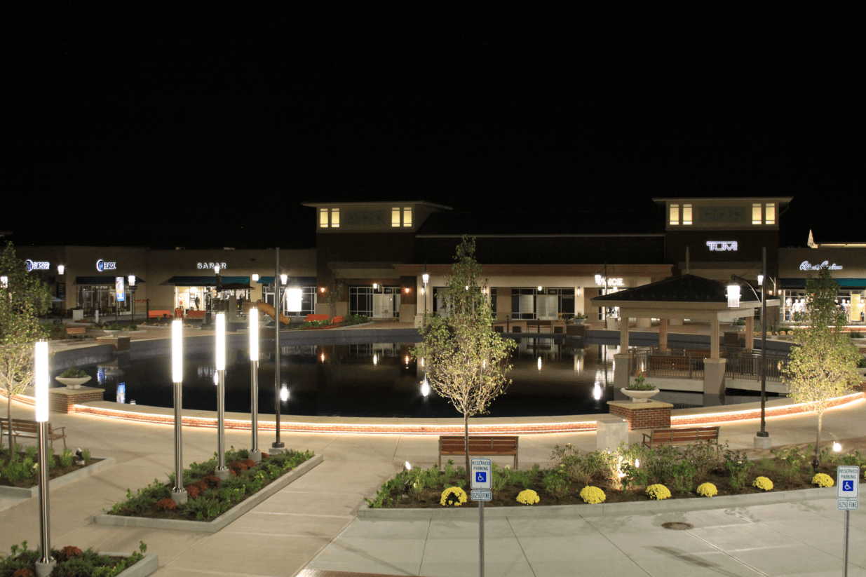The parking lot area at Chicago Premium Outlets with light poles and decorative lighting.