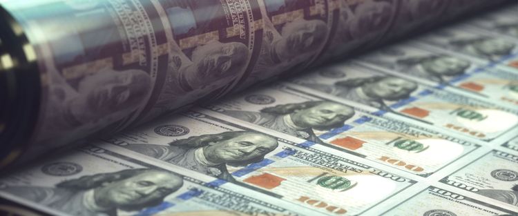 A sheet of $100 bills being printed