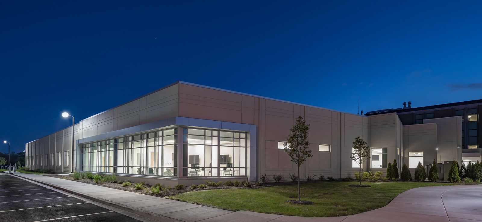Exterior facade of Advocate Health South illuminated during nighttime.