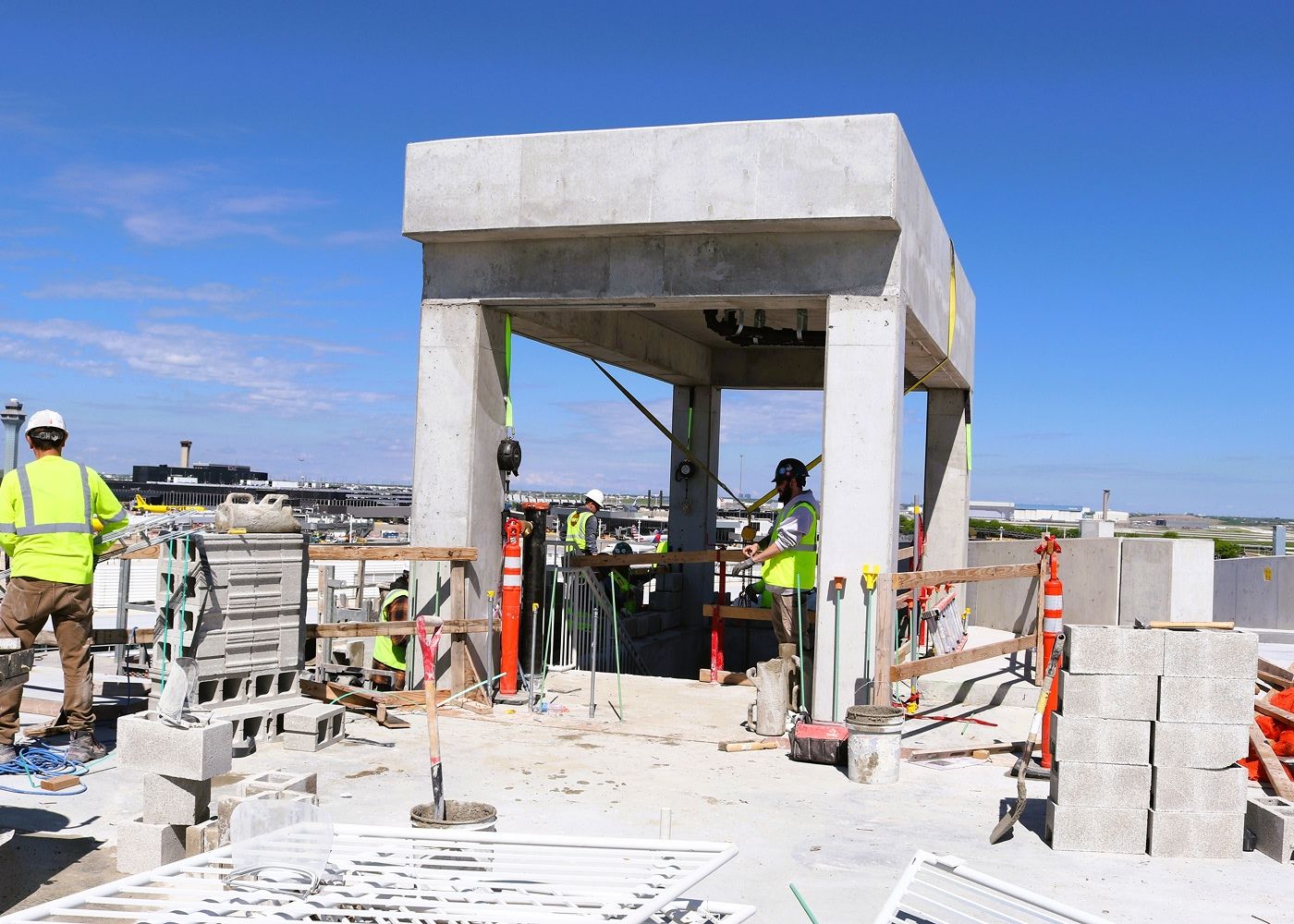 Workers on top of the terminal 5 parking deck.