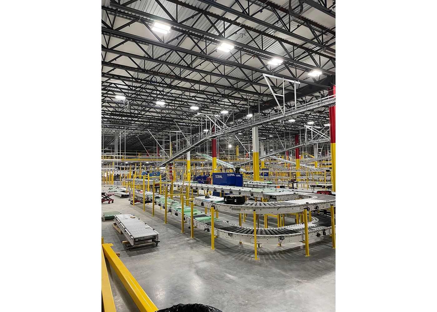 The inside of the center showing conveyors systems as well as bright ceiling lights.