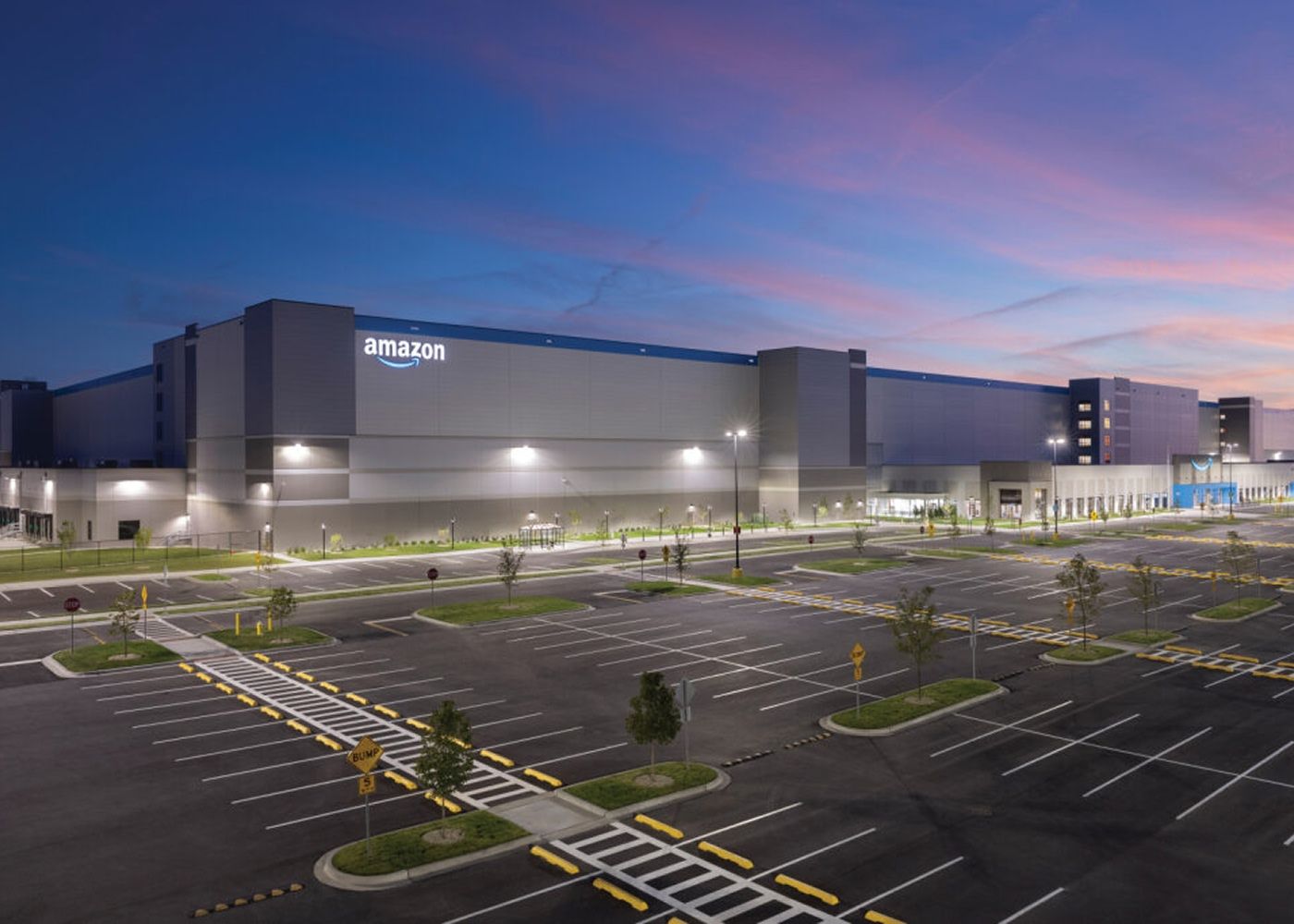 The outside of Amazon's center during the night.
