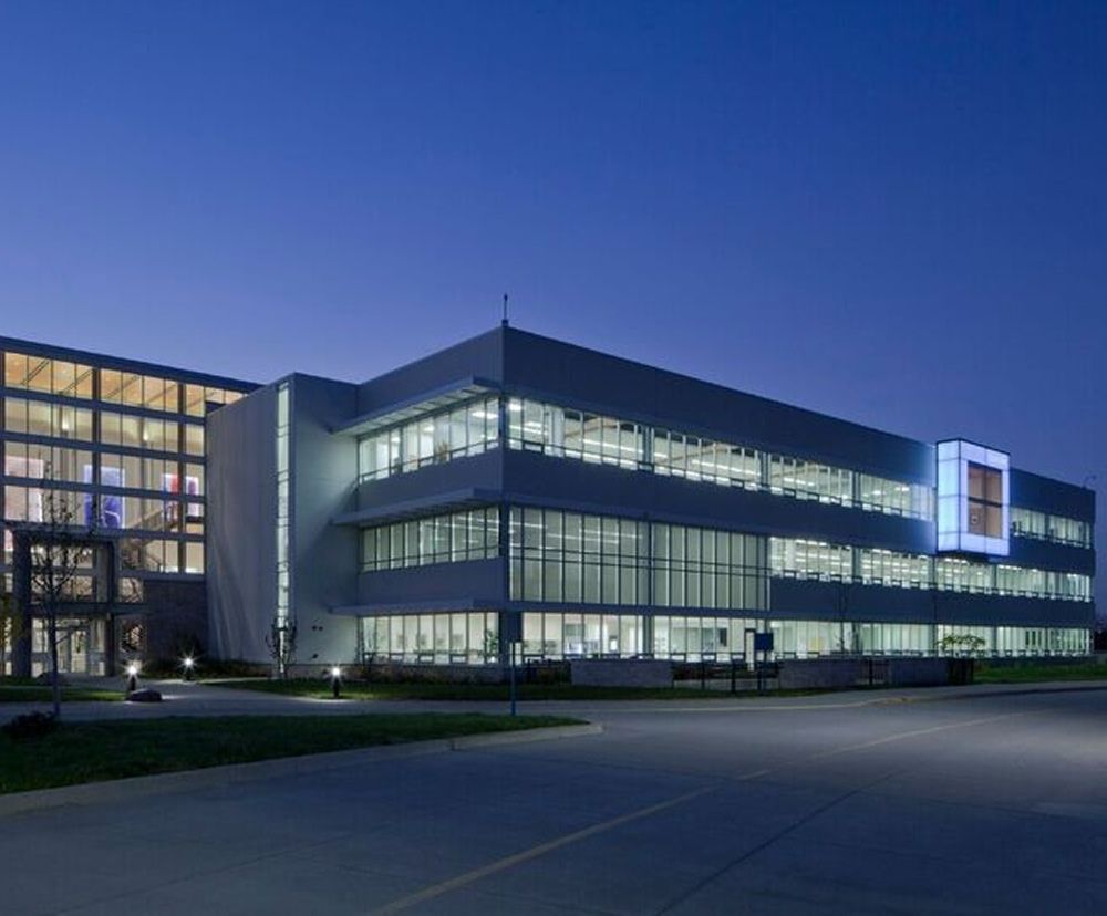 The illuminated exterior facade of Sunstar at nighttime.