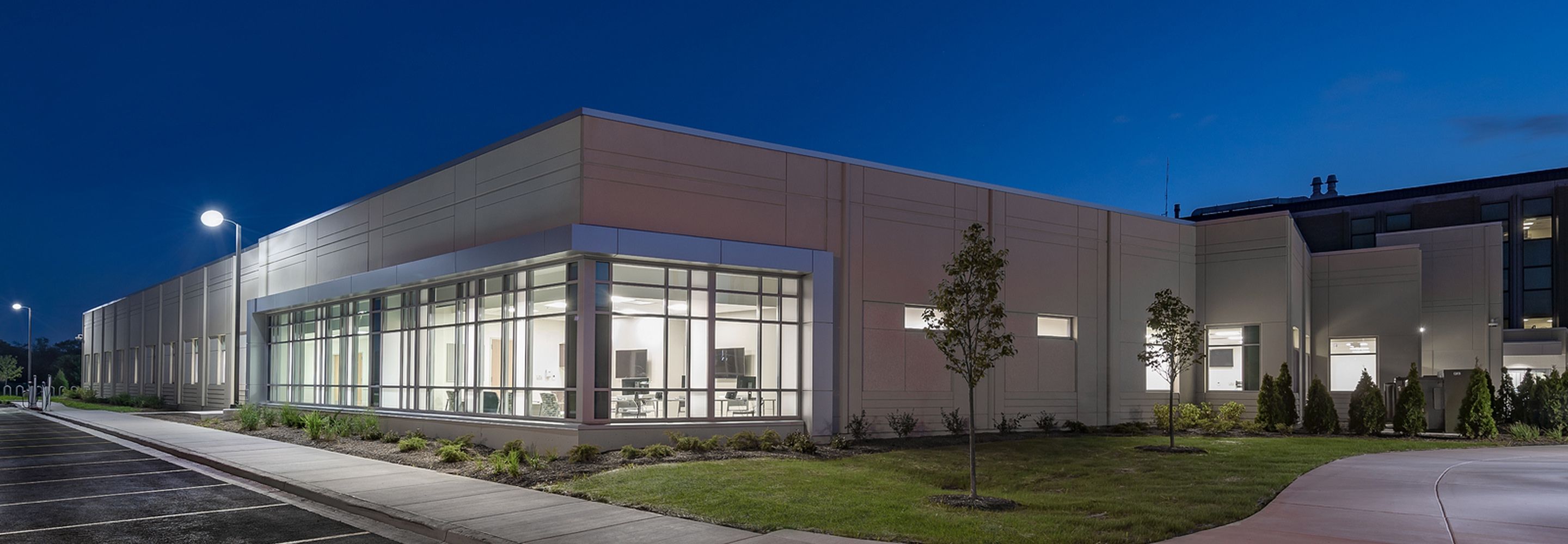 Exterior facade of Advocate Health South illuminated during nighttime.