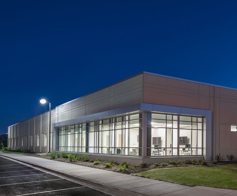Exterior facade of Advocate Health South illuminated during nighttime.