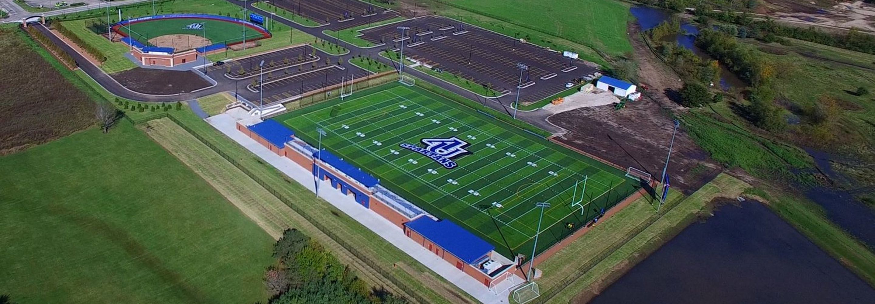 An aerial view of the Spartan sports complex, showcasing a football and baseball field.