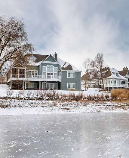 house overlooking frozen lake