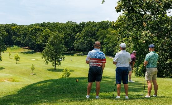 men playing golf on the course