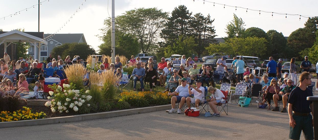 Community members watching an event at Geneva National Community
