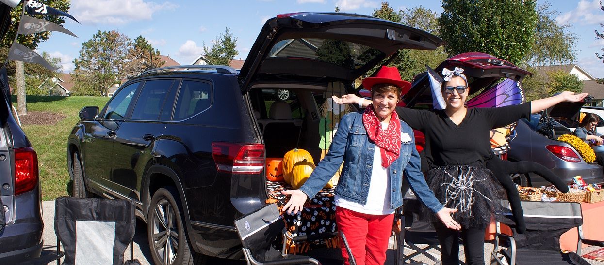 People dressed up in costume during Trunk or Treat