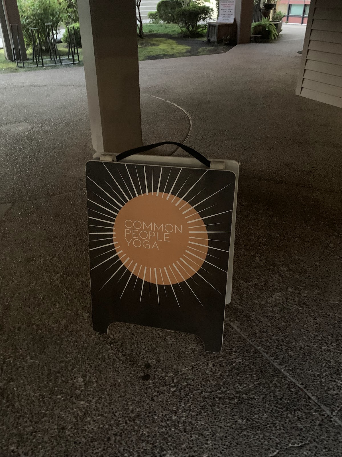 Common People Yoga sidewalk sign outside the Salem studio