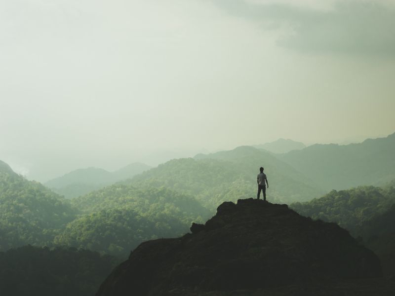 Person on a hill staring into the distance. Alfred Aloushy, Unsplash