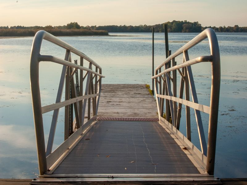 A bridge leading down into water. Matt Bango, StockSnap.