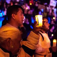 People holding candles