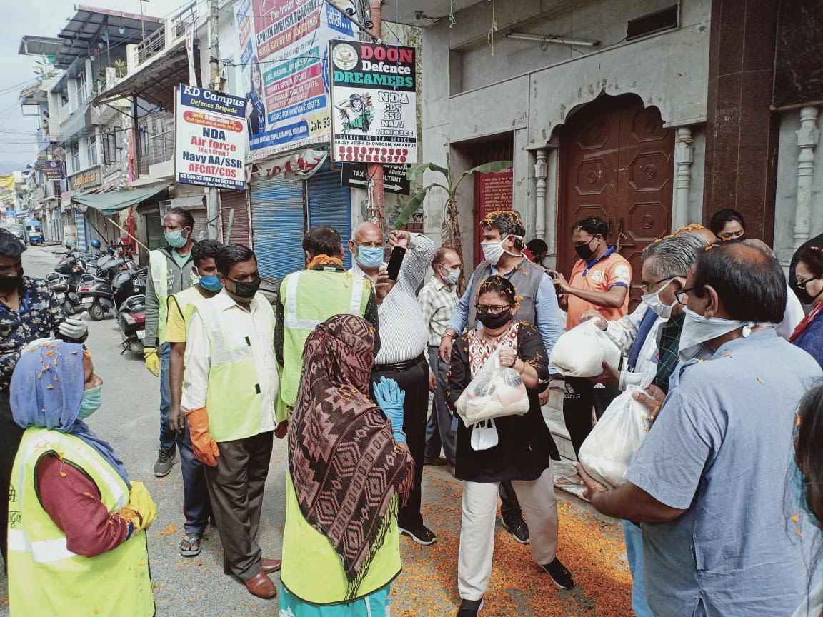 Woman handing out food packages