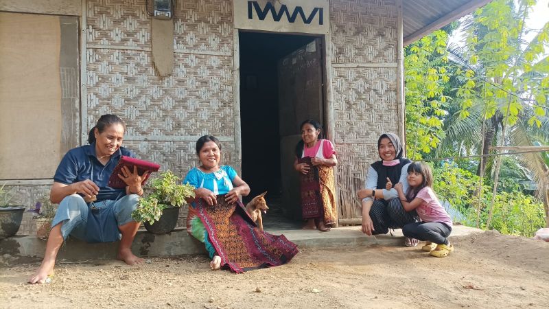 Ima and Martha (with Mama Tin left) with the woven cloth they make