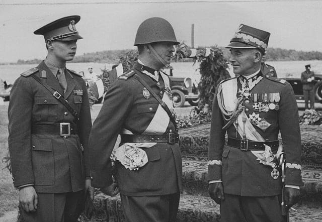 1937: King Carol II of Romania (center, with the uniform of Polish colonel), prince Michael of Romania (left) and Marshall Edward Rydz-Śmigły