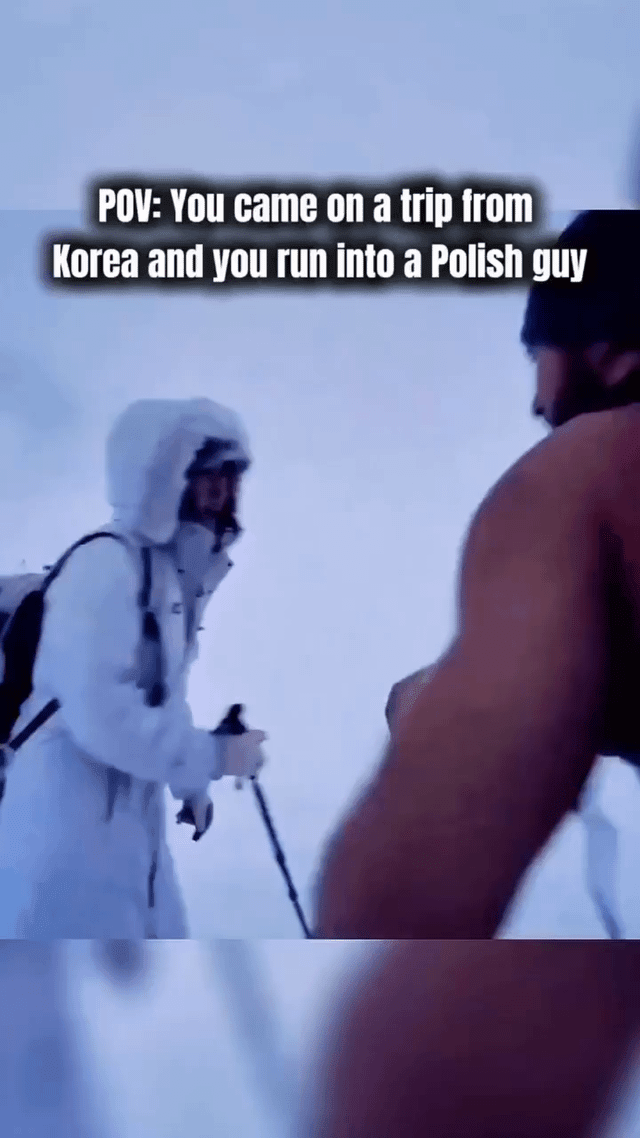 Polish man walks up a snowy mountain without excessive clothing.