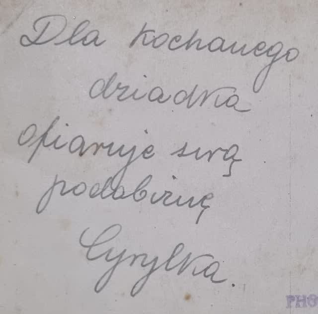 Please, would anyone help to translate this photo inscription? Particularly her name.