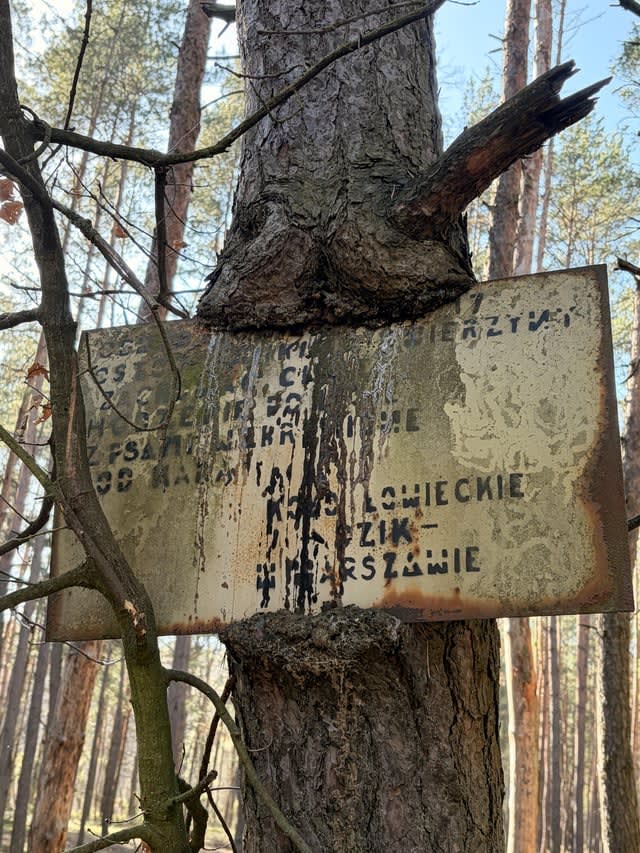 What does the sign say? Found in forest near Warsaw