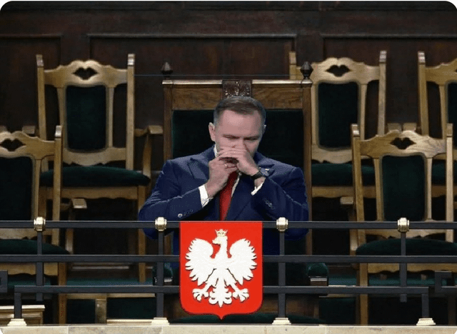 President Karol Nowrocky welcoming members of parliament by playing the harmonica - A.D. 2026