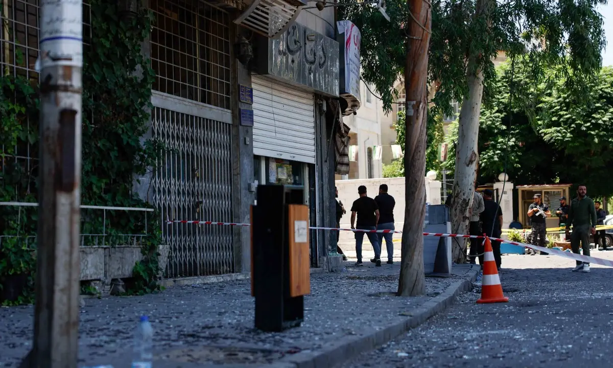 Damascus blasts during Macron's visit injure 18
