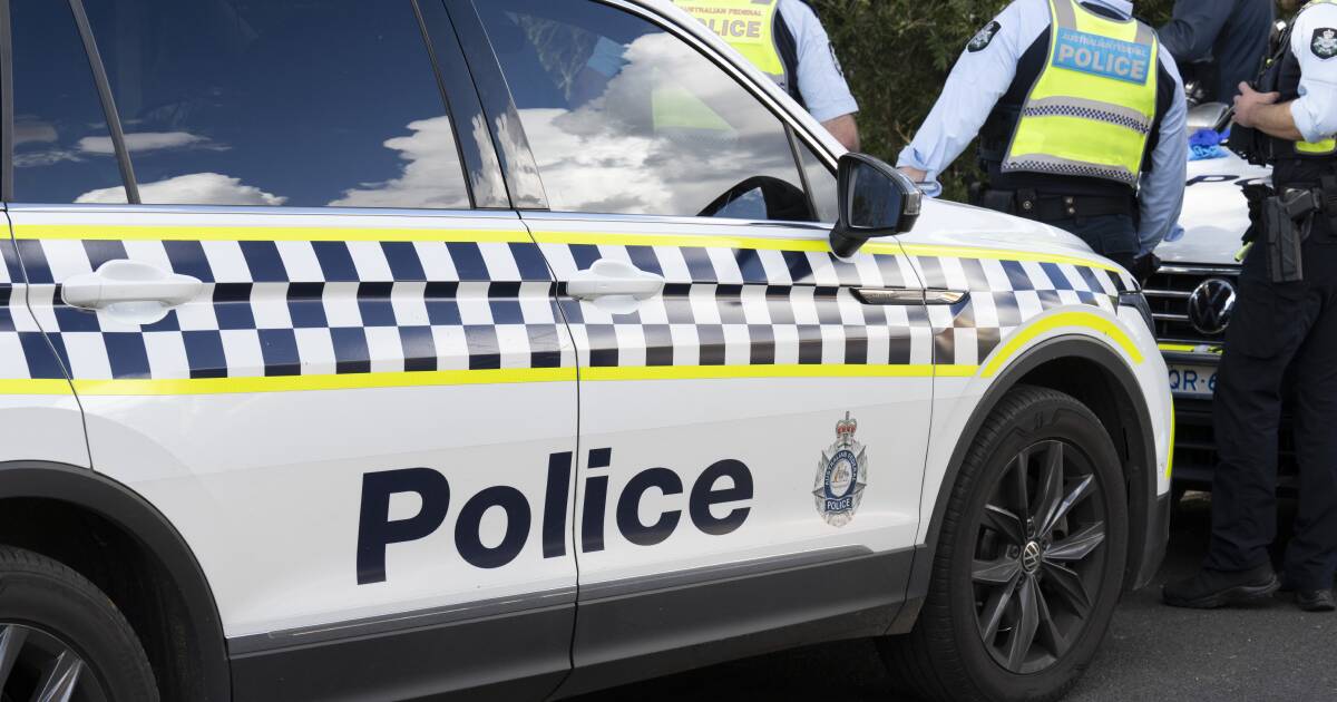 Driver taken to hospital after car collision with police unit on Hindmarsh Drive