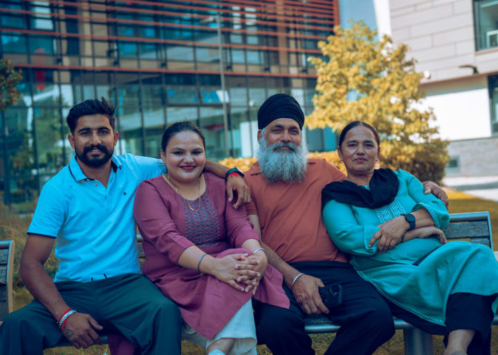 The four together, smiling
